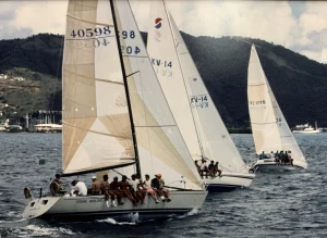 John Glynn from Bitter End Yacht Club helming Cosmic Warlord at the 20th Annual in 1991. To leeward are Peter Haycraft and Sam Laing.