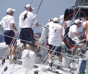 This recalls the first of two adventures with Roy Disney (recent Sailing Hall of Fame “Lifetime Achievement” award winner) and crew aboard Pyewacket in 2002. What an honor and privilege to sail with this legendary team. That’s me, circled in red, pretending to be strong as “Tiny” on the winch-grinding pedestal. Mr Disney is just aft of me in both photos.